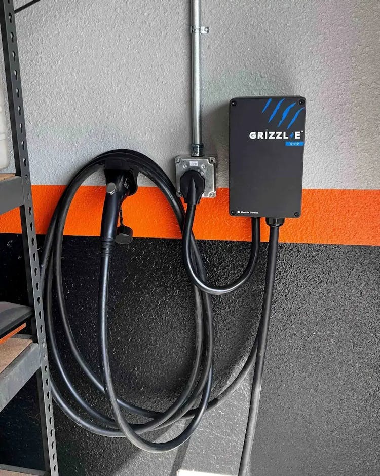 Grizzl-E Duo Level 2 charger on garage wall
