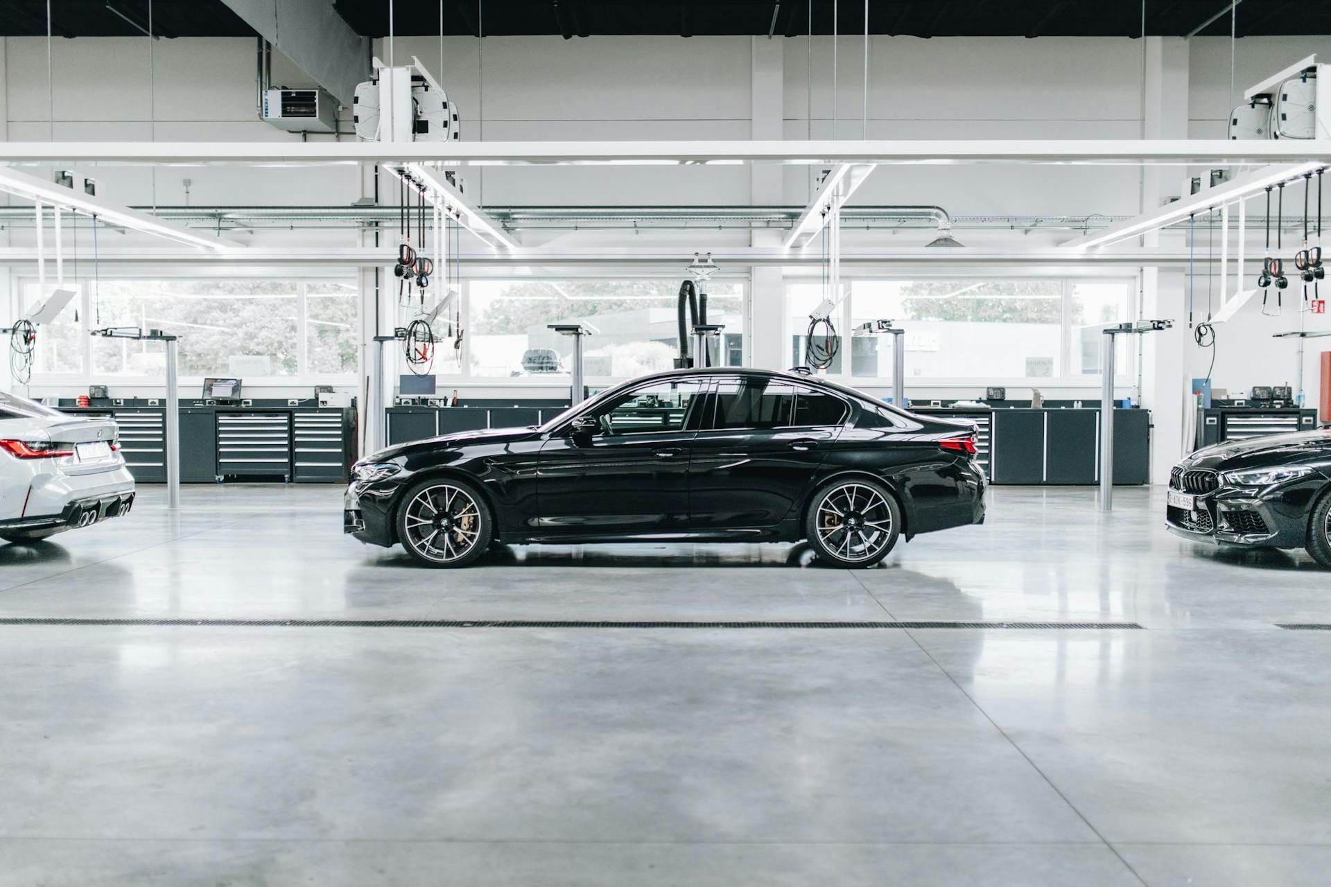 Black car inside modern dealership