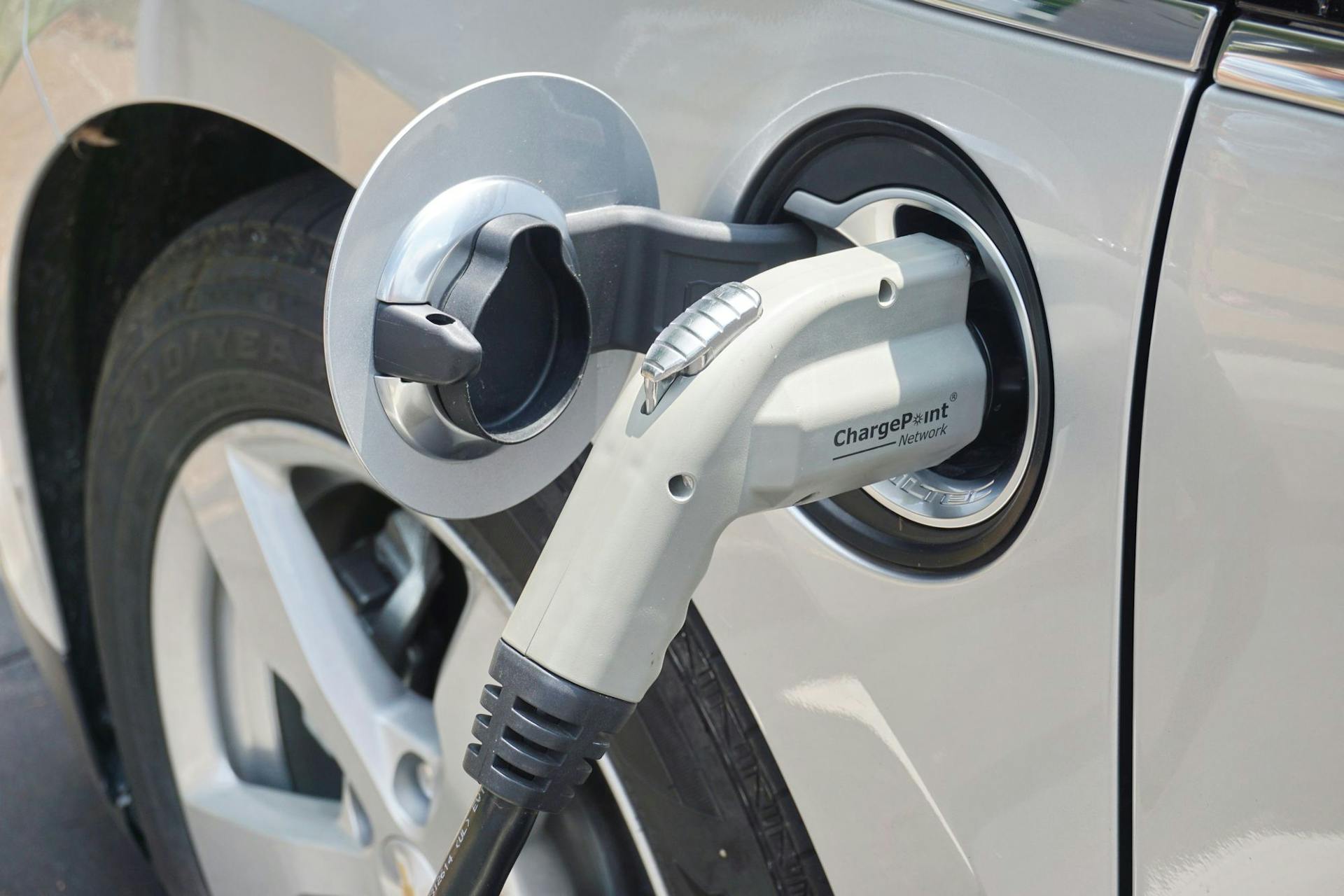 Chargepoint EV charger charging a white electric vehicle